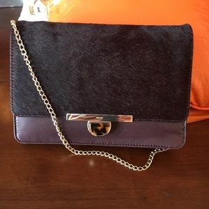 Beautiful DKNY brown bag with calf hair flap and removable gold chain.